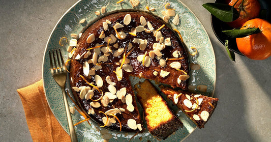 Orange almond cake with marmalade gin glaze and lemon curd mascarpone is a beautiful slice of sunshine