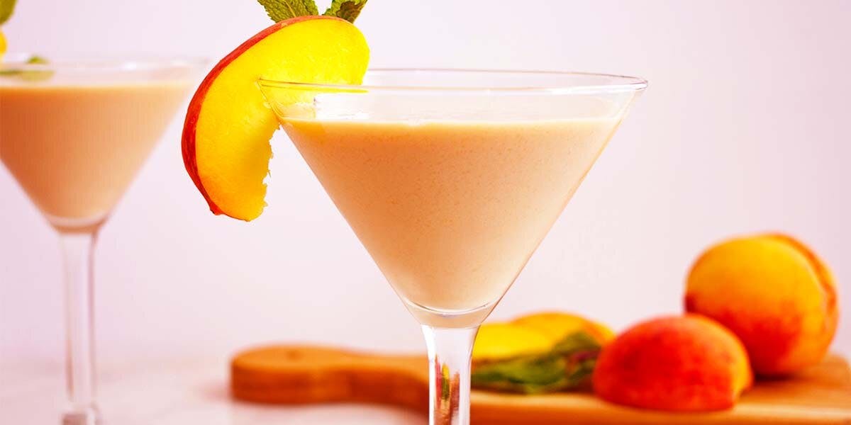 A dreamy dessert cocktail of peaches, cream and gin is summer sipping heaven